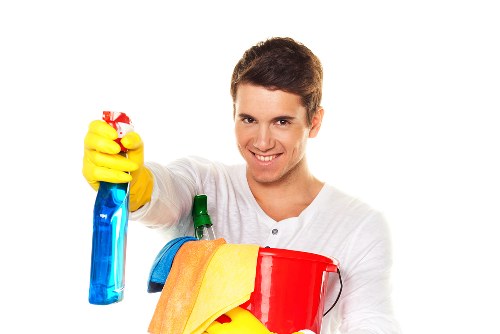 Technician treating a carpet stain during cleaning
